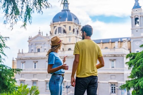 Tourist couple visiting Madrid city on summer vacation. Traveler vacation concept