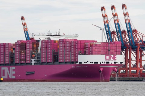 Pink container freighter One Innovation of the shipping company Ocean Network Express (Europe) Ltd.