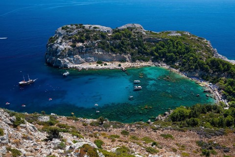 Beach umbrellas and sunbeds, turquoise waters, Anthony Quinn Bay, Faliraki, Rhodes, Dodecanese,