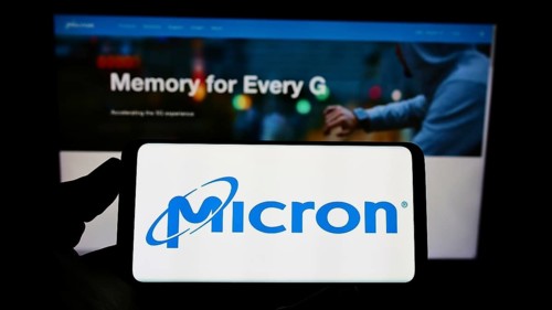 Stuttgart, Germany, 12-01-2022: Person holding cellphone with logo of American semiconductor