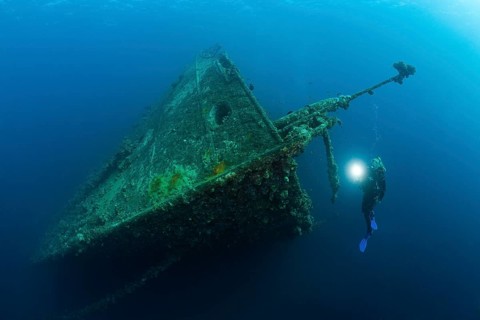 Divers on the wreck of the Umbria, Wingate Reef, Red Sea, Sudan, Africa