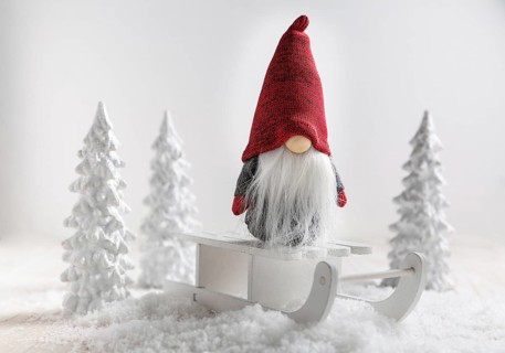 Christmas imp on sleigh with snowy landscape. Christmas decoration