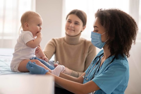 Little baby being health clinic vaccination