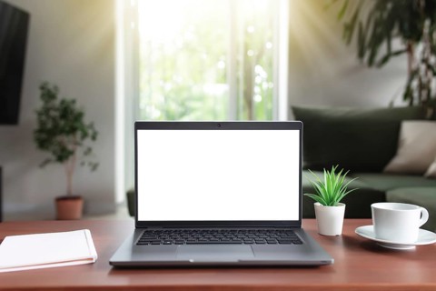 Work from home, workspace, desktop, remote work concept, gray laptop computer with empty white