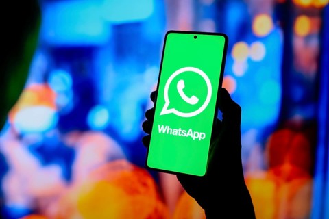 In this photo illustration, the WhatsApp logo is displayed on a smartphone screen