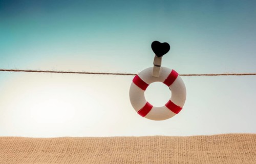 Life preserver attached to a string with heart icon