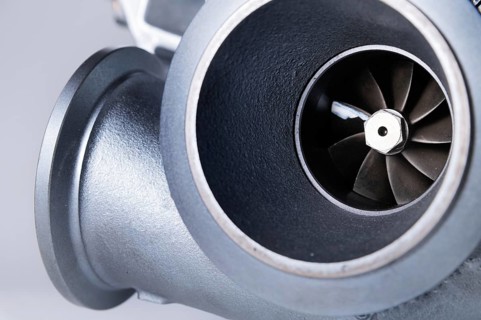 New turbocharged engine on a gray background. Impeller parts