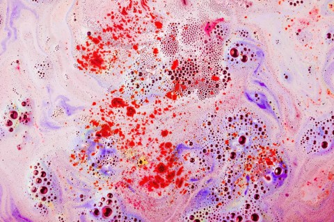 Red purple textured surface with dissolve bathbomb