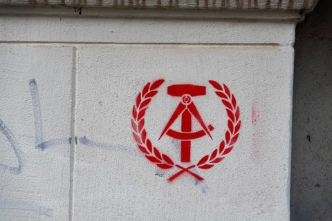 State coat of arms of the GDR as graffiti, hammer, compass, spike wreath, Germany, Europe
