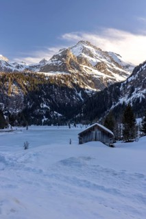 Frozen Lake Lauenen with a view of the Wildhorn and Arpelistock, Lauenen b. Gstaad, Bern,