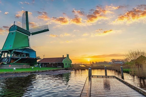 Sunrise at Zaanse Schans village with Dutch Windmill near Amsterdam Netherlands