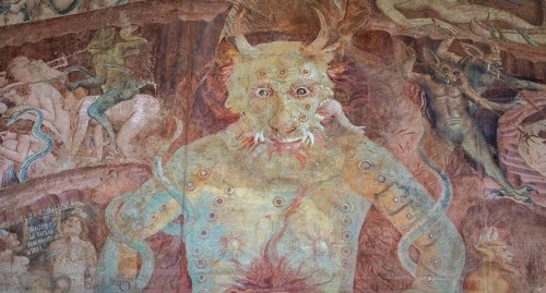 Pisa, Italy, 29 June 2023: Fresco in the Cemetery with Satan and the medieval hell, gothic design,