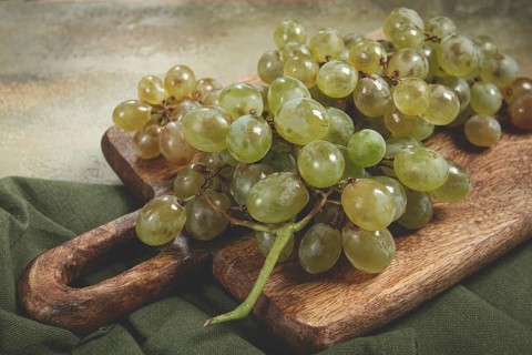 A branch of white grapes, wine grapes, Georgian grape variety Rkatsiteli, top view
