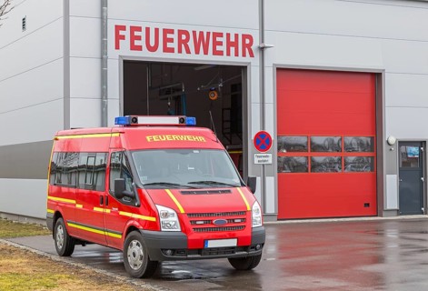 Fire brigade vehicle in front of fire station in Bavaria