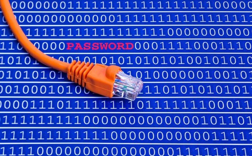 The photo shows a binary code with a network cable