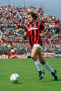 Football match, captain Franco BARESI AC Milan running with the ball to the left, in the background