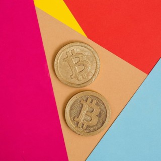 Two bitcoins many colorful background