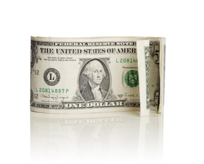 Old curly US dollar bills isolated on white with natural reflection