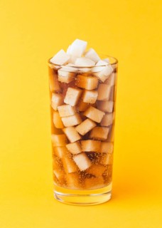 Front view sugar cubes glass with soft drink