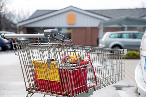 Shopping trolley in the car park of a discount store