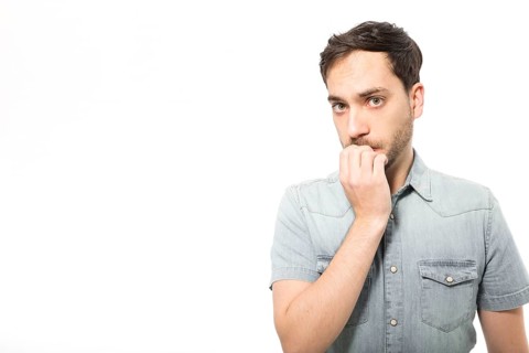 Nervous man looking camera