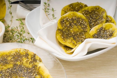 Lebanese manouche or manoushe, lebanese pizza with thyme and sesame seeds, zaatar, and extra virgin