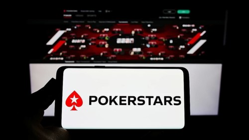 Stuttgart, Germany, 01-06-2022: Person holding smartphone with logo of online poker cardroom