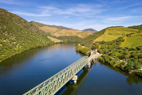 Douro railway bridge drone aerial view of river wine region in Ferradosa, Portugal, Europe
