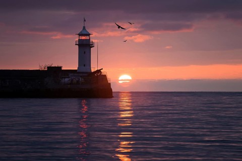 Lighthouse on sunrise. Yalta, Crimea, Ukraine, Europe