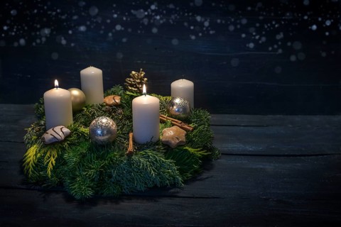 Green advent wreath with white candles, two are lit for second advent, Christmas decoration and