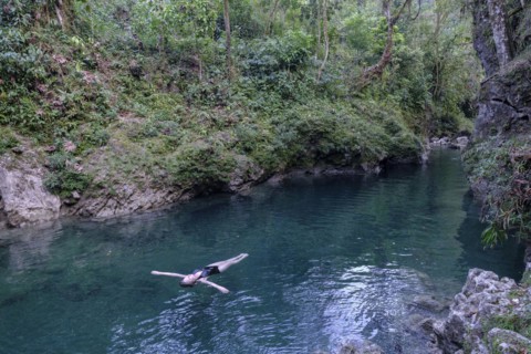 Bather in the river Cuatro Chorros, Lancetillo-La Parroquia, Zona Reina, Quiche, Guatemala, Central