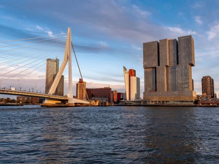 Erasmus Bridge by Ben van Berkel and modern skyscraper with office building (Maasturm) De Rotterdam