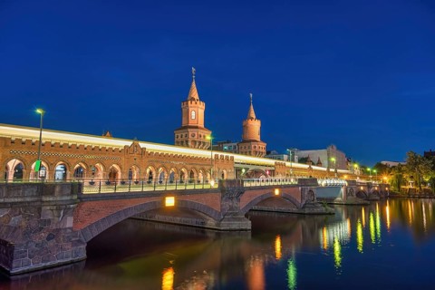 Berlin Germany, sunset city skyline at Oberbaum Bridge and Spree River