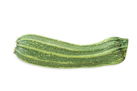 Single courgette Costata Romanesco on white background