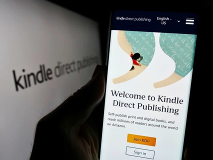 Stuttgart, Germany, 11-09-2023: Person holding mobile phone with website of Amazon e-book platform