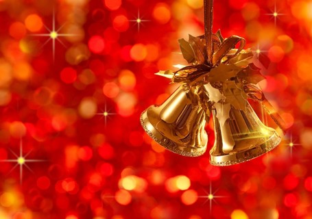 Gold Christmas tree decorations on lights background