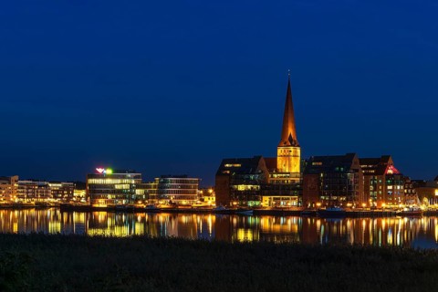 View across the Warnow to the Hanseatic city of Rostock in the evening