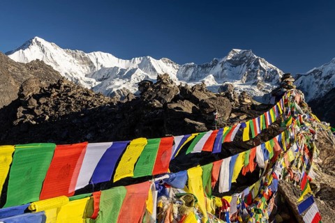 Buddhist prayer flags marking the summit of Gokyo Ri, the popular trekking peak in the Everest