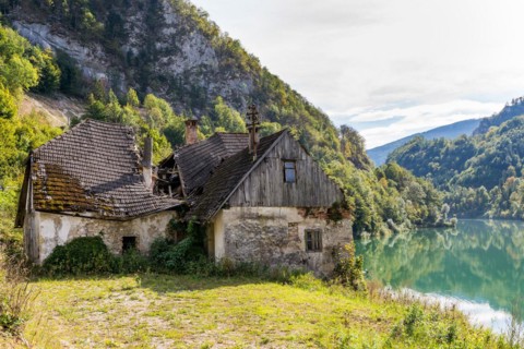 Deserted farm at the Enns river in Upper Austria. The roof is collapsed. The management of the farm