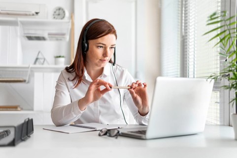 Portrait woman work having video call laptop