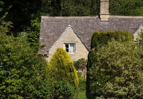 Small houses in typical Cotswolds style adorn the streets of the small town of Bibury