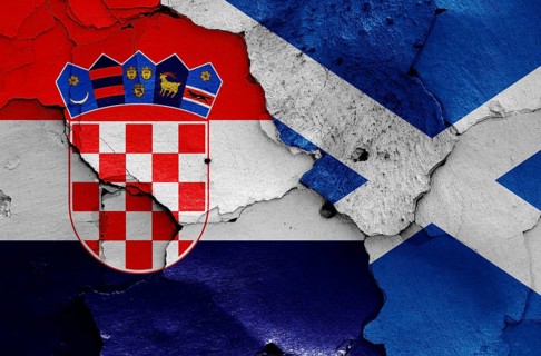 Flags of Croatia and Scotland painted on cracked wall