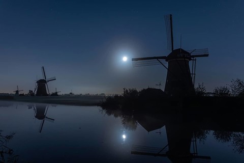 Foggy moonlit night at Kinderdijk, Netherlands