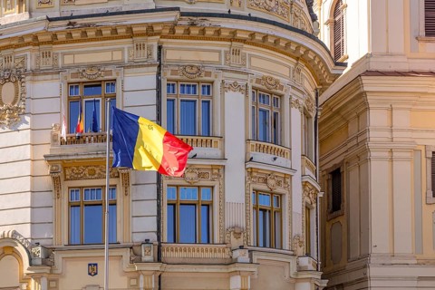 Romanian flag in front of the building that house Sibiu municipality, Sibiu, Transylvania, Romania,