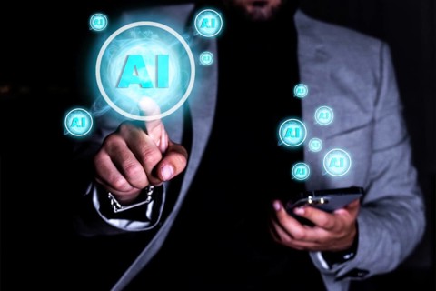 Close up of a businessman using a mobile phone and pointing his finger to the front. Concept of use