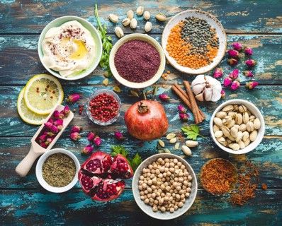 Arab ingredients for middle eastern food. Arabic cuisine ingredients on blue wooden background.
