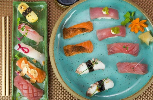 Platter with different types of nigirizushi, nigiri with different fish and one decorated with a