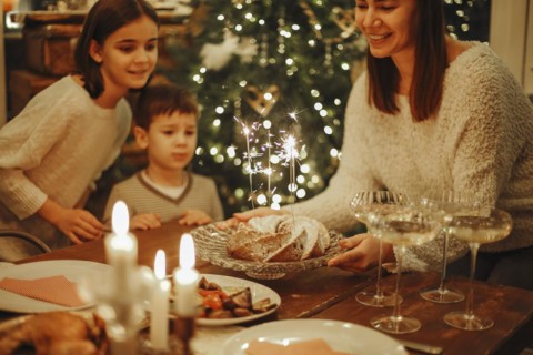 Happy big family with children celebrate New Year at cozy warm homely atmosphere near xmas tree,