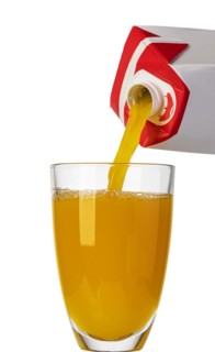 Pouring orange juice from bottle into glass, isolated on white