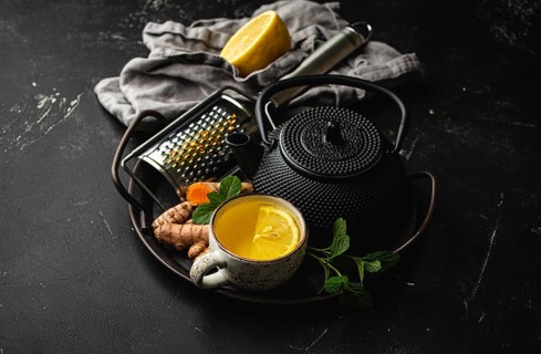Healthy warm herbal turmeric tea for boosting immune system. Ingredients for making detox tea in